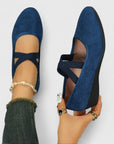 Blue wedge ballet flats with ankle strap and cross straps, open arch design.