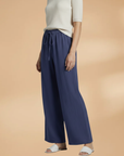 Women’s navy blue wide-leg linen trousers, back view, elastic drawstring waist