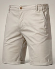Men's chino shorts in beige, back view with waistband and patch pockets