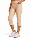 Beige capri pants with mid-rise pull-on waist, cropped tapered legs and stretch fit