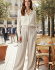 Cream linen-blend wide-leg trousers, high-waist with pleated front and wide legs