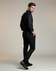 High-waisted tailored trousers in black, tapered legs and front button closure