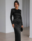 Black satin midi dress with long sleeves, tied waist detail and side slit.