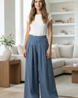 Light blue linen-blend wide-leg trousers, high-waist with pleated front and wide legs