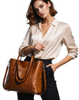 Cognac leather tote bag with double handles and front zip pocket