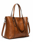 Cognac leather tote bag with top handles, front pocket, and shoulder strap