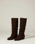 Brown knee-high chunky heel boots, pair standing, smooth suede-look finish