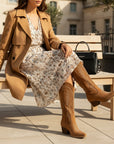 Brown suede cowboy boots with embroidered panels and stacked block heel