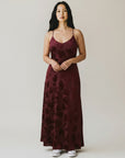 Burgundy jacquard maxi dress with spaghetti straps and dark floral pattern
