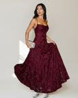 Burgundy jacquard maxi dress with spaghetti straps, V-neck, and flared skirt
