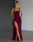 Wine red evening maxi dress with square neckline and flowing skirt slit