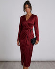 Red satin midi wrap dress, V-neck and tied waist, long sleeves, side slit.