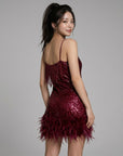 Red sequin mini dress with spaghetti straps and feather fringe trim
