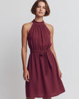 Sleeveless high-neck dress with gathered neckline and tie waist in burgundy
