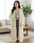 Women's long knitted cardigan, cream, open-front with two patch pockets and ribbed trim