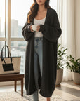 Women's long knitted cardigan, black, open-front with patch pockets and ribbed cuff details