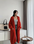 Women's long knitted cardigan, bright red, open front with patch pockets and wide cuffs