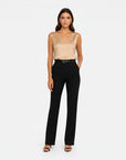 Beige satin sleeveless V-neck blouse with smooth drape front.