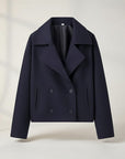 Navy double-breasted jacket with structured lapels, four-button front, and flap pockets