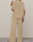Women's beige set, back view: short-sleeve top and wide-leg trousers
