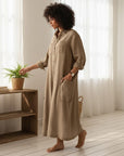 Women’s beige oversized cotton-linen jumpsuit with button front and long sleeves