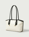 Off-white tote bag with black handles and subtle trim