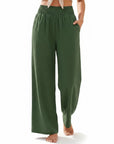 Olive-green smocked high-waist wide-leg pants with gathered elastic waistband