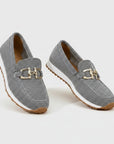 Gray woven slip-on loafers with gold bit hardware and light tan rubber sole.