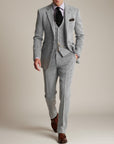Grey tweed three-piece suit with vest and trousers, single-breasted blazer and pocket square