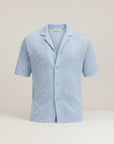 Men's light-blue knit short-sleeve button-up shirt, open collar, textured weave