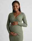 Green ribbed maternity midi dress with long sleeves and wrap-front crossover bodice