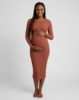 Rust ribbed maternity midi dress with long sleeves and wrap-front crossover bodice