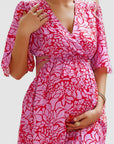 Floral chiffon maternity maxi dress, pink-and-white print, wrap V-neck, gathered waist