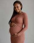 Rust ribbed maternity midi dress with long sleeves and crossed wrap neckline