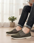 Men's dark green suede driving loafers with lace-up vamp and white flat sole