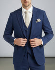 Navy three-piece suit set with tailored jacket, waistcoat, and matching trousers