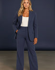 Navy tailored blazer and wide-leg pants set with front button closure