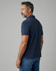 Men's navy cotton polo shirt from the back, short sleeves