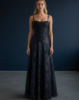 Black floral maxi dress with spaghetti straps and corset-style bodice, full skirt