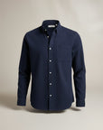 Men's slim fit long sleeve button-up shirt, solid navy with chest pocket and buttons