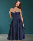 Navy fitted midi dress with adjustable spaghetti straps and gathered skirt