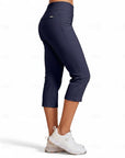 Navy blue capri pants side view with stretch fabric and cropped tapered leg