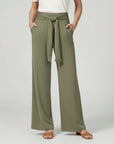 Green relaxed wide-leg trousers with tie waist and draped front.