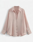 Light pink long-sleeve button-up blouse with collared neckline and button front