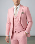 Pink three-piece suit set with tailored jacket, waistcoat, and matching trousers