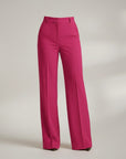 High-waist tailored trousers in bright pink with belt loops and front button closure