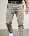 Beige plaid slim-fit ankle-length trousers with belt loops and button fly