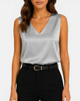 Light gray satin sleeveless V-neck blouse with draped neckline.
