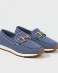 Blue slip-on loafers with gold metal bit detail and textured upper, grippy sole.