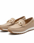 Beige slip-on loafers with gold metal bit detail, stitched seams, cushioned sole.